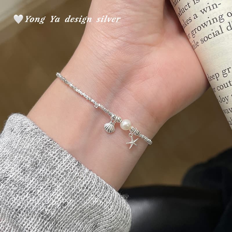 Bracelet en coquillage perforé