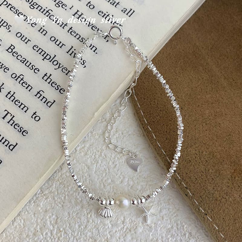 Bracelet en coquillage perforé