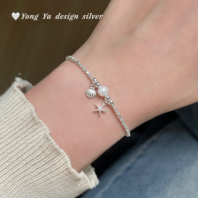 Bracelet en coquillage perforé